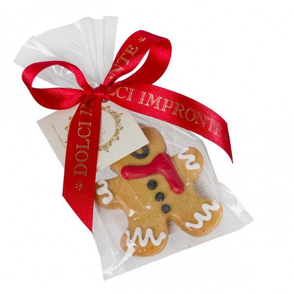 Biscuit artisanal de Noël pour chien en forme de pain d'épices, décoré d'une écharpe rouge, emballé dans un sac personnalisé Dolci Impronte.