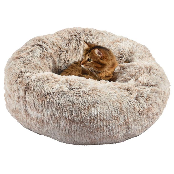 Image d'un animal de compagnie détendu et confortablement installé dans le lit Poilu Bobby Donut de Bobby Canifrance, exprimant sécurité et sérénité.